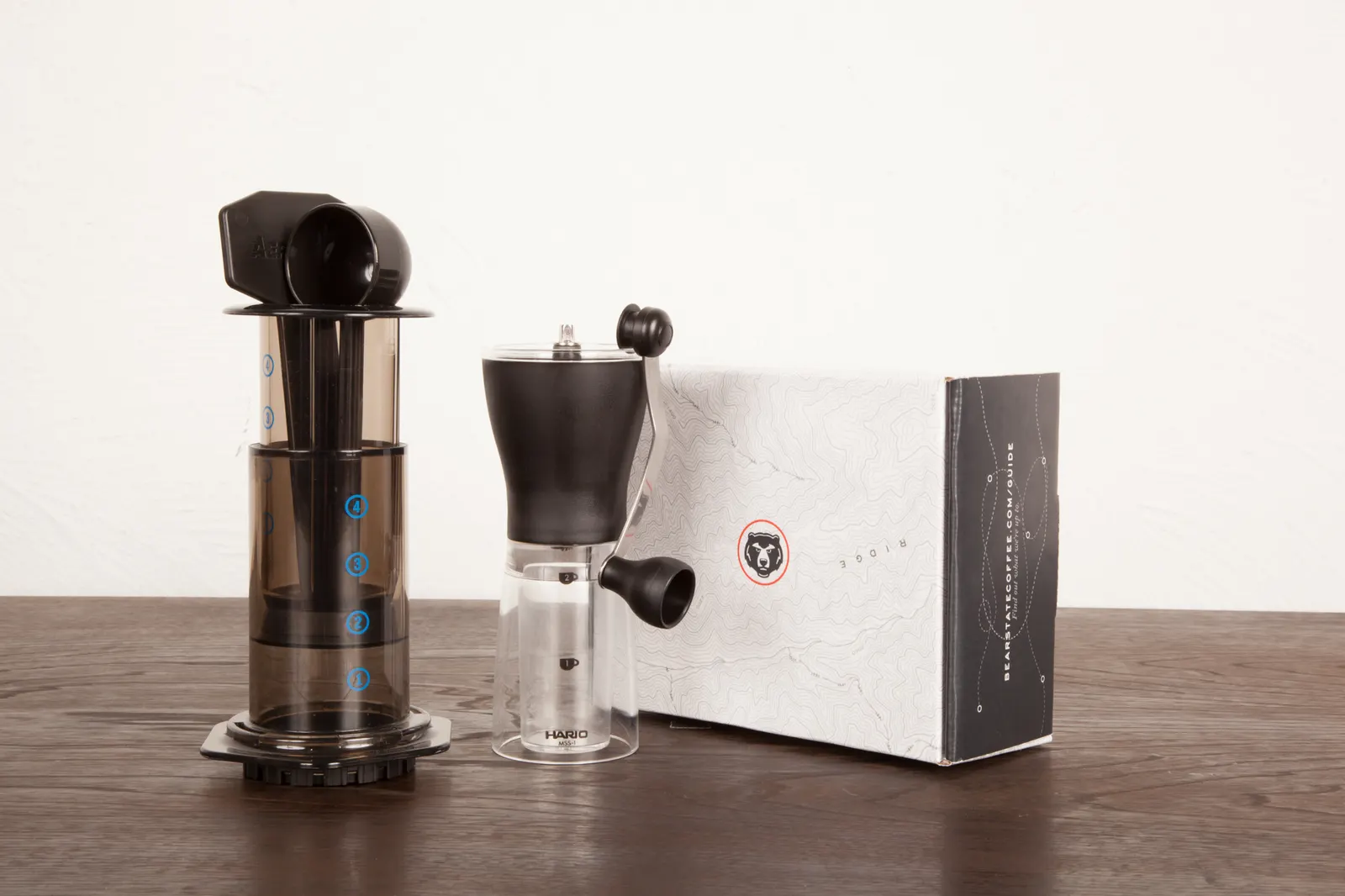 A grinder and brewing kit on a counter